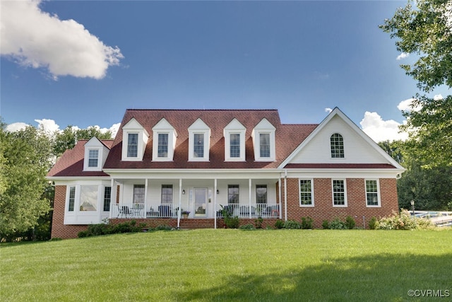 2104 Apple Grove Rd, Mineral, VA 23117 - cape cod house featuring a porch, a front yard, and brick siding