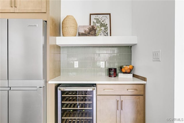 7418 Cherokee Rd, Richmond, VA 23225 - bar area featuring stainless steel fridge, beverage cooler, and tasteful backsplash