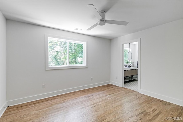 7418 Cherokee Rd, Richmond, VA 23225 - empty room with plenty of natural light, light wood-style flooring, and ceiling fan