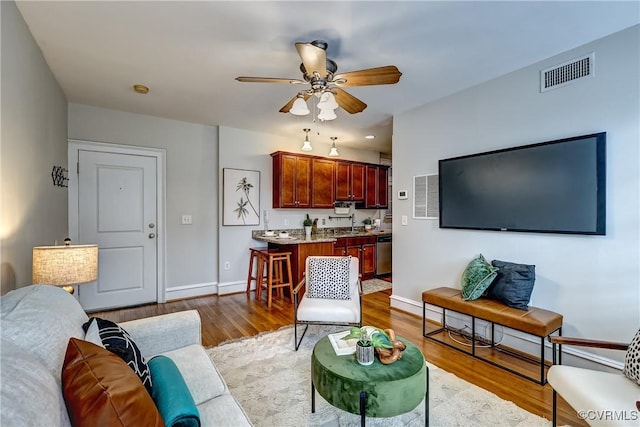 2710 Stuart Ave Unit U3, Richmond, VA 23220 - living room with a ceiling fan and wood finished floors