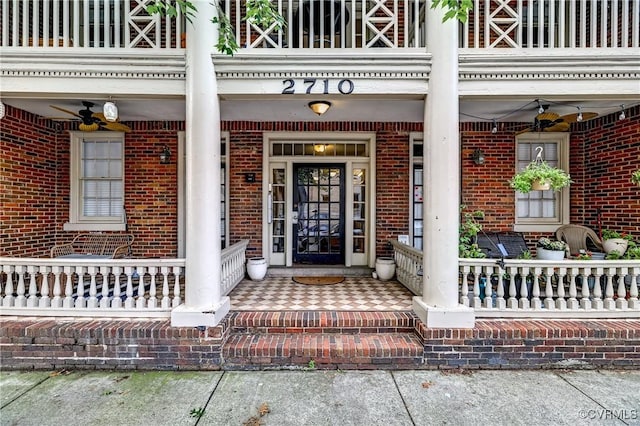 2710 Stuart Ave Unit U3, Richmond, VA 23220 - view of exterior entry with a balcony, brick siding, and a porch