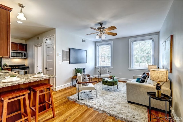 2710 Stuart Ave Unit U3, Richmond, VA 23220 - living room with a ceiling fan and light wood-type flooring
