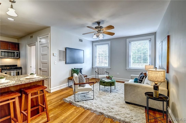 2710 Stuart Ave Unit U3, Richmond, VA 23220 - living area featuring ceiling fan and light wood-style flooring