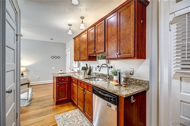 2710 Stuart Ave Unit U3, Richmond, VA 23220 - kitchen featuring stainless steel dishwasher, light wood finished floors, stone counters, and a peninsula