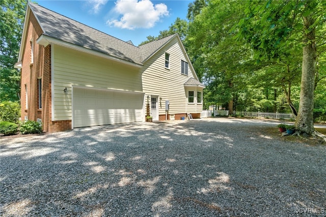 4800 Bailey Branch Ln, Quinton, VA 23141 - view of side of home with driveway, a shingled roof, and brick siding