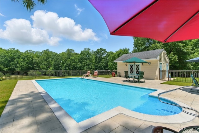 4800 Bailey Branch Ln, Quinton, VA 23141 - view of pool featuring a patio area, an outbuilding, and a storage structure