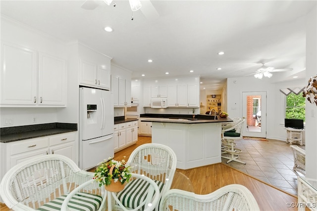 4800 Bailey Branch Ln, Quinton, VA 23141 - kitchen featuring white appliances, ceiling fan, dark countertops, white cabinets, and recessed lighting
