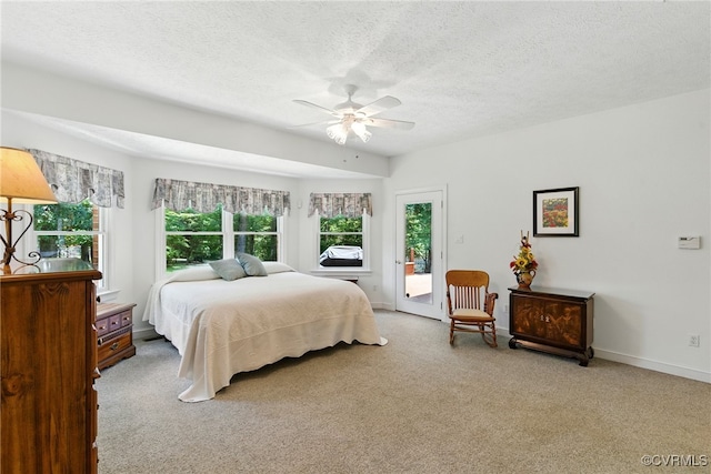 4800 Bailey Branch Ln, Quinton, VA 23141 - bedroom with access to outside, carpet flooring, a textured ceiling, and ceiling fan