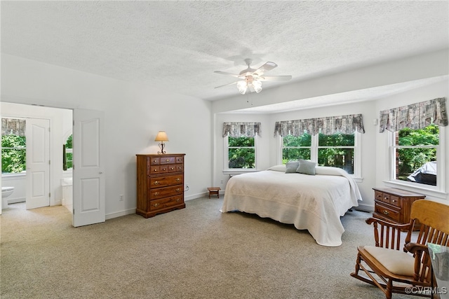4800 Bailey Branch Ln, Quinton, VA 23141 - bedroom with light colored carpet, a textured ceiling, ceiling fan, and ensuite bath