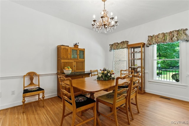 4800 Bailey Branch Ln, Quinton, VA 23141 - dining area with a chandelier and light wood-style flooring