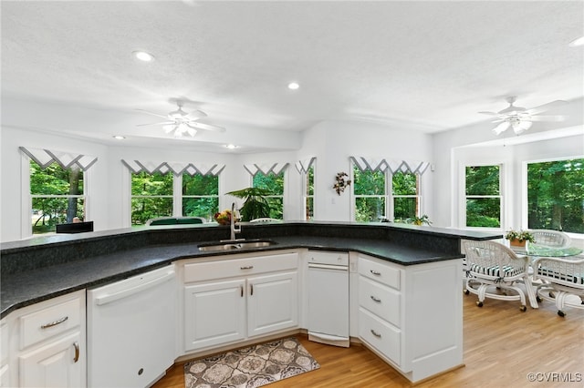 4800 Bailey Branch Ln, Quinton, VA 23141 - kitchen featuring dishwasher, a ceiling fan, light wood-type flooring, white cabinets, and dark countertops