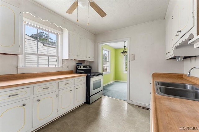 200 Hargrave Ave, Colonial Heights, VA 23834 - kitchen with stainless steel electric range oven, white cabinets, a ceiling fan, tile patterned floors, and wooden counters