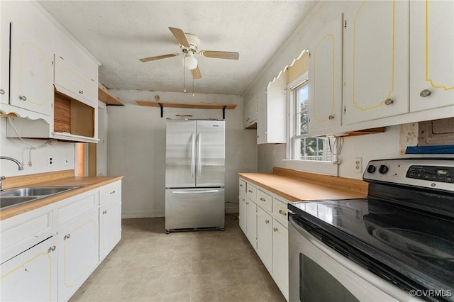 200 Hargrave Ave, Colonial Heights, VA 23834 - kitchen with stainless steel appliances, white cabinets, a ceiling fan, light countertops, and a textured ceiling