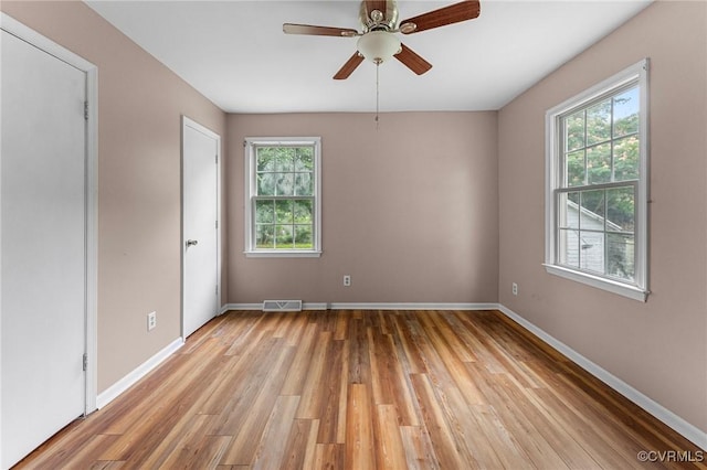 200 Hargrave Ave, Colonial Heights, VA 23834 - unfurnished room featuring healthy amount of natural light, light wood finished floors, and ceiling fan