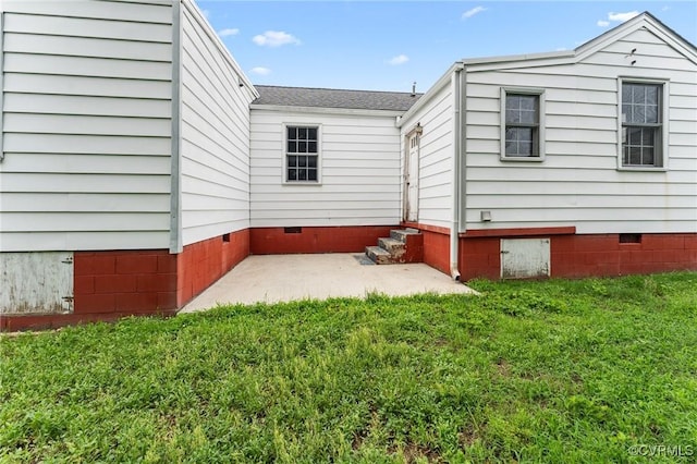 200 Hargrave Ave, Colonial Heights, VA 23834 - view of home's exterior featuring crawl space, a lawn, a shingled roof, and a patio area