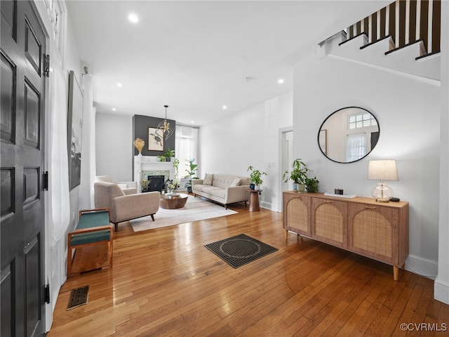 130 N Jefferson St, Petersburg, VA 23803 - living room with hardwood / wood-style floors, a fireplace, and recessed lighting