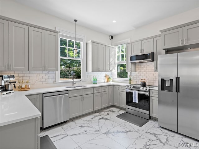 130 N Jefferson St, Petersburg, VA 23803 - kitchen featuring appliances with stainless steel finishes, gray cabinetry, light marble finish floors, healthy amount of natural light, and recessed lighting