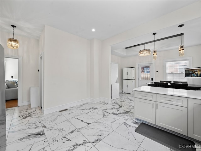 130 N Jefferson St, Petersburg, VA 23803 - kitchen with a chandelier, light marble finish flooring, recessed lighting, light countertops, and freestanding refrigerator
