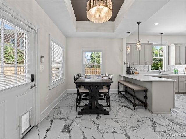 130 N Jefferson St, Petersburg, VA 23803 - dining room with light marble finish flooring, healthy amount of natural light, a tray ceiling, and recessed lighting