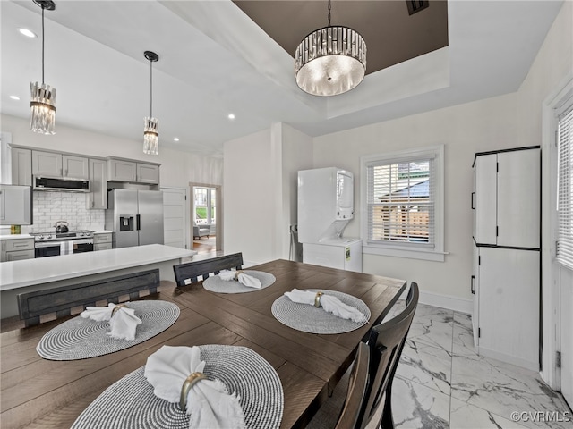 130 N Jefferson St, Petersburg, VA 23803 - dining space featuring estacked washer and dryer, light marble finish floors, and recessed lighting
