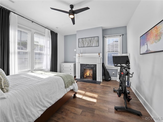 130 N Jefferson St, Petersburg, VA 23803 - bedroom featuring a premium fireplace, wood finished floors, and a ceiling fan
