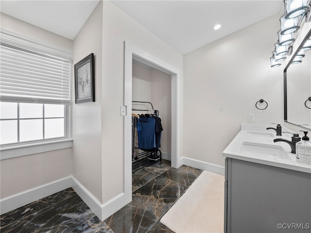 130 N Jefferson St, Petersburg, VA 23803 - full bath with marble finish flooring, double vanity, a spacious closet, and recessed lighting