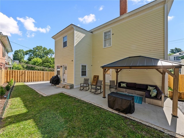 130 N Jefferson St, Petersburg, VA 23803 - back of house with outdoor lounge area, a gazebo, a patio area, a fenced backyard, and a chimney