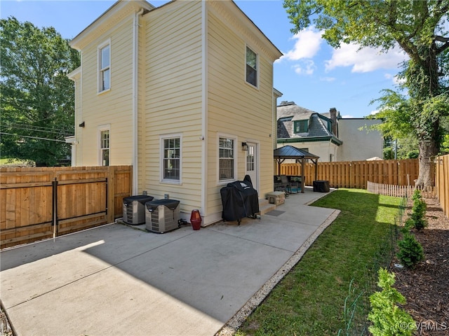 130 N Jefferson St, Petersburg, VA 23803 - back of house featuring a gazebo, a patio area, and a fenced backyard