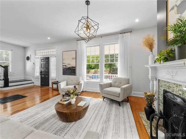 130 N Jefferson St, Petersburg, VA 23803 - living area with wood finished floors, recessed lighting, and a tiled fireplace