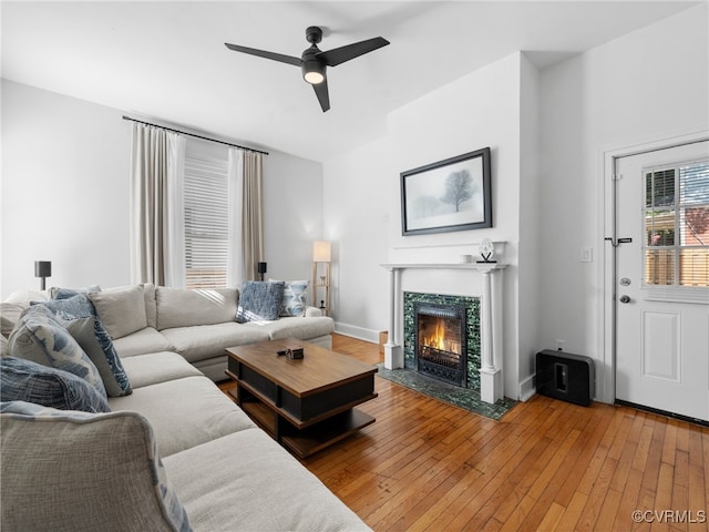 130 N Jefferson St, Petersburg, VA 23803 - living room with a tile fireplace, ceiling fan, and wood-type flooring