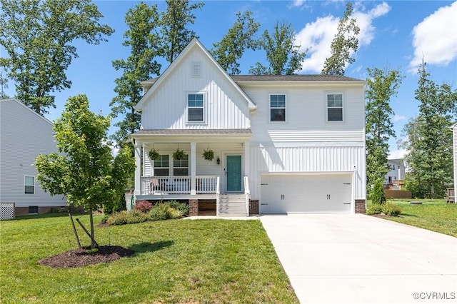 236 Central Pkwy, Aylett, VA 23009 - view of front of home with board and batten siding, a porch, an attached garage, driveway, and a front lawn