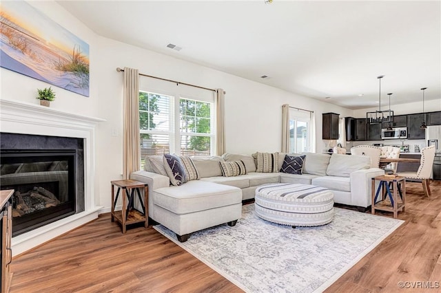 236 Central Pkwy, Aylett, VA 23009 - living room featuring light wood-style flooring and a glass covered fireplace