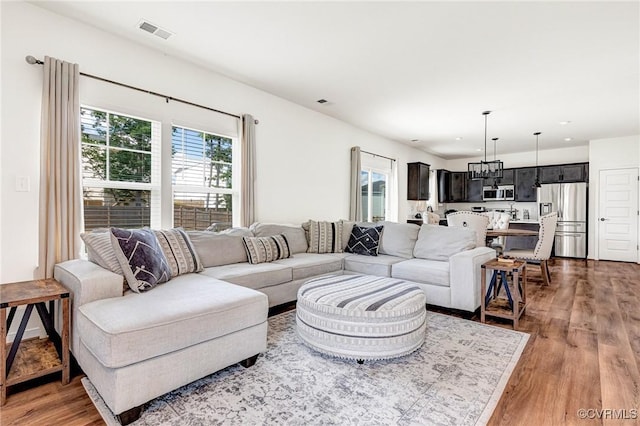 236 Central Pkwy, Aylett, VA 23009 - living area with light wood-type flooring, recessed lighting, and a chandelier