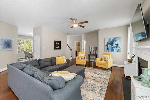 8307 Badestowe Ct, Chesterfield, VA 23832 - living area featuring stairway, a ceiling fan, dark wood-style floors, and a fireplace
