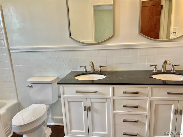 318 Youngs Rd, Petersburg, VA 23803 - bathroom featuring double vanity, tile walls, and shower / washtub combination