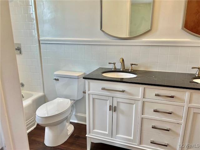 318 Youngs Rd, Petersburg, VA 23803 - bathroom featuring vanity, wood finished floors, shower / bathtub combination, and decorative backsplash