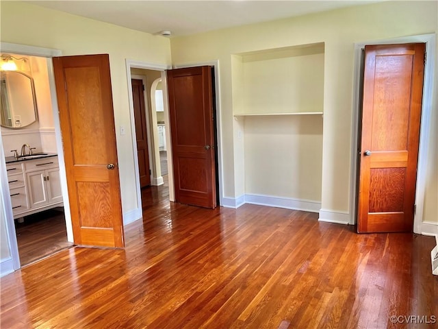 318 Youngs Rd, Petersburg, VA 23803 - unfurnished bedroom with wood finished floors and arched walkways