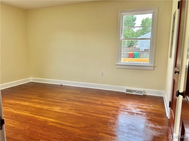 318 Youngs Rd, Petersburg, VA 23803 - empty room with dark wood-type flooring and baseboards