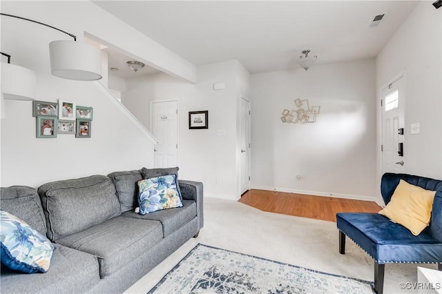 6007 Faulkner Dr, North Chesterfield, VA 23234 - carpeted living room featuring stairs and baseboards
