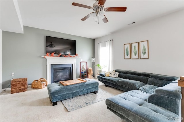 6007 Faulkner Dr, North Chesterfield, VA 23234 - living area with carpet, a glass covered fireplace, and ceiling fan