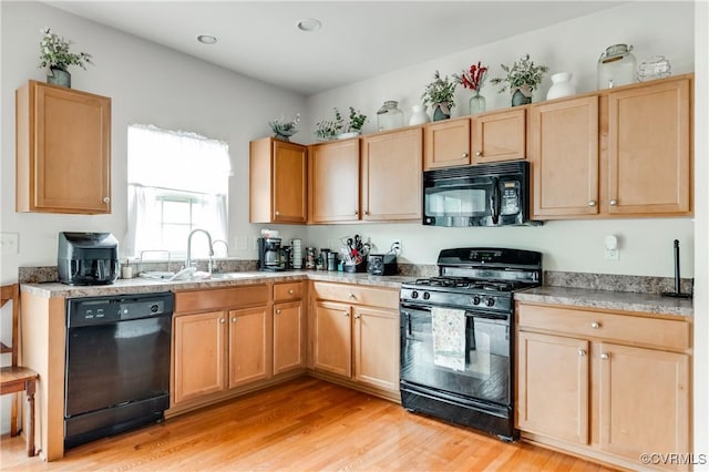 6007 Faulkner Dr, North Chesterfield, VA 23234 - kitchen with black appliances, light wood finished floors, light brown cabinetry, and light countertops