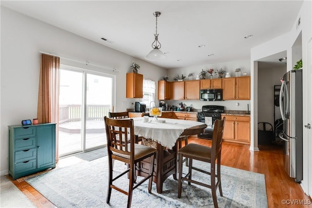6007 Faulkner Dr, North Chesterfield, VA 23234 - dining area with light wood-style floors and recessed lighting