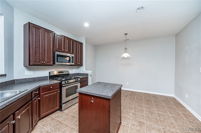 3133 Abruzzo Pl, Glen Allen, VA 23059 - kitchen featuring stainless steel appliances, dark countertops, recessed lighting, decorative light fixtures, and a kitchen island