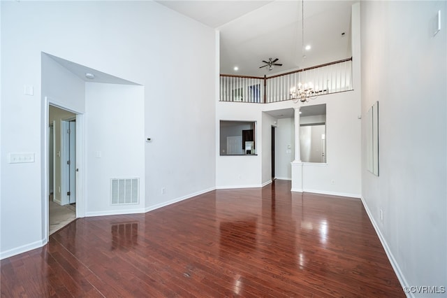 3133 Abruzzo Pl, Glen Allen, VA 23059 - unfurnished living room featuring hardwood / wood-style floors, a towering ceiling, and a chandelier