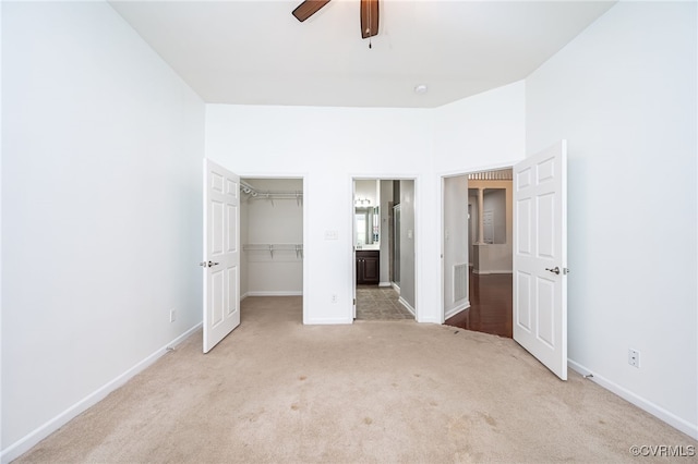 3133 Abruzzo Pl, Glen Allen, VA 23059 - unfurnished bedroom with light colored carpet, a spacious closet, a closet, ensuite bathroom, and ceiling fan