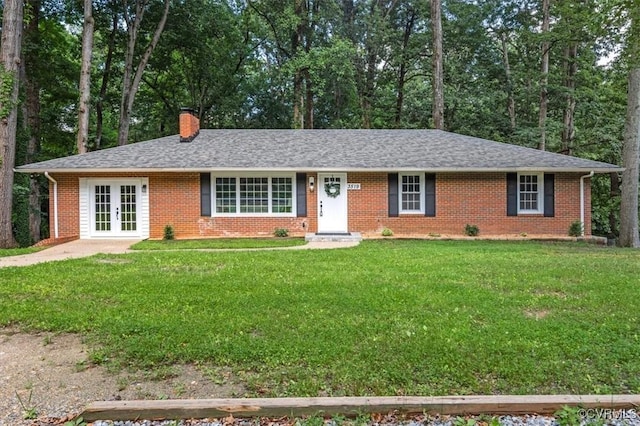 3519 Murchies Hill Rd, Richmond, VA 23234 - ranch-style home with french doors, a chimney, brick siding, a front lawn, and a shingled roof
