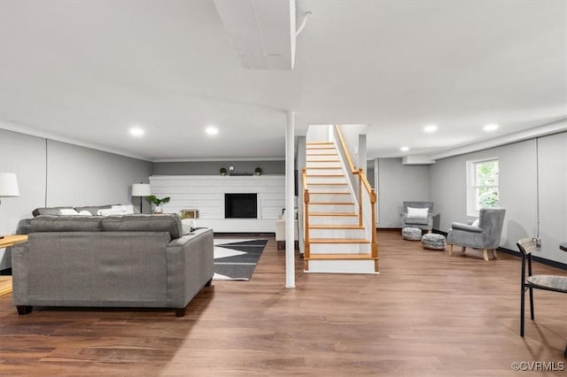 3519 Murchies Hill Rd, Richmond, VA 23234 - living area featuring stairs, recessed lighting, wood finished floors, a fireplace, and crown molding