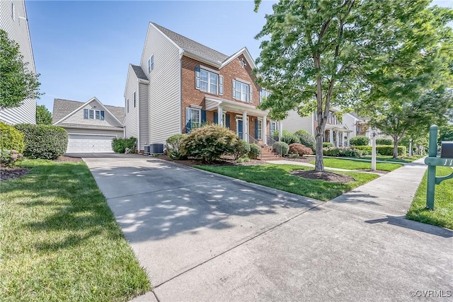 11420 Willows Green Way, Glen Allen, VA 23059 - traditional-style home featuring a garage, a front yard, brick siding, and driveway