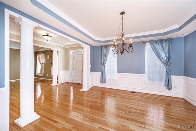 11420 Willows Green Way, Glen Allen, VA 23059 - unfurnished dining area featuring a chandelier, decorative columns, light wood finished floors, ornamental molding, and a decorative wall