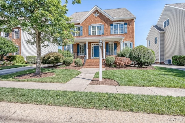 11420 Willows Green Way, Glen Allen, VA 23059 - view of front of home featuring brick siding, a porch, and a front lawn